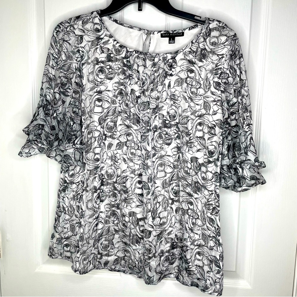 Sara Michelle Black and White Floral Top with ruffled sleeves